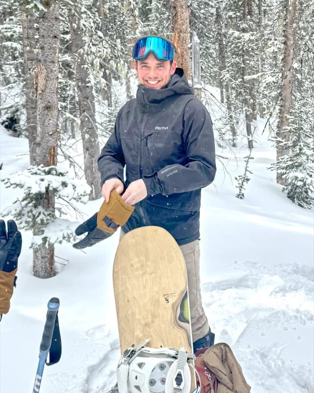Joel Peckham snowboarding in the mountains near Laramie, Wyoming.